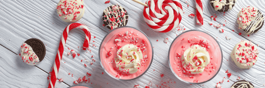 two red peppermint sea moss smoothies with candy canes 