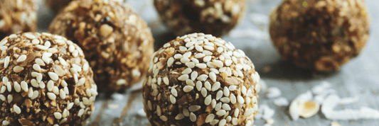 five Energy Balls rolled in sesame seeds