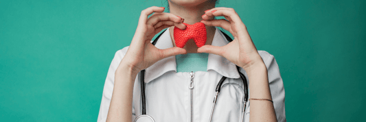 Doctor holding thyroid gland over neck with two hands