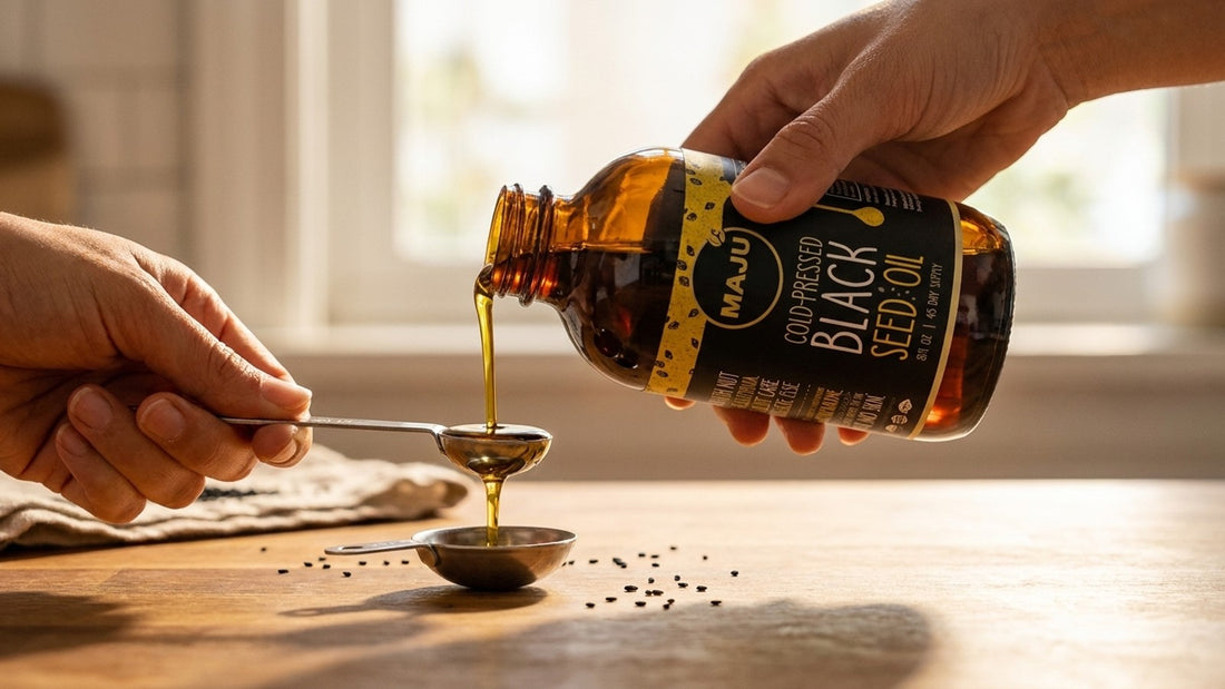 Pouring a precise teaspoon of MAJU black seed oil