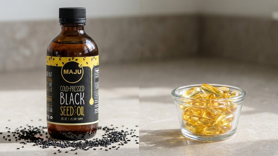 MAJU black seed oil bottle beside a dish of generic fish oil softgels