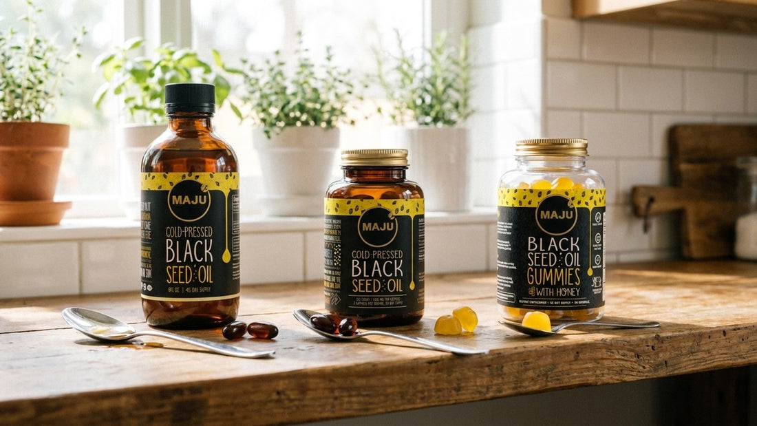 MAJU black seed oil liquid, capsules and gummies lined up on a shelf