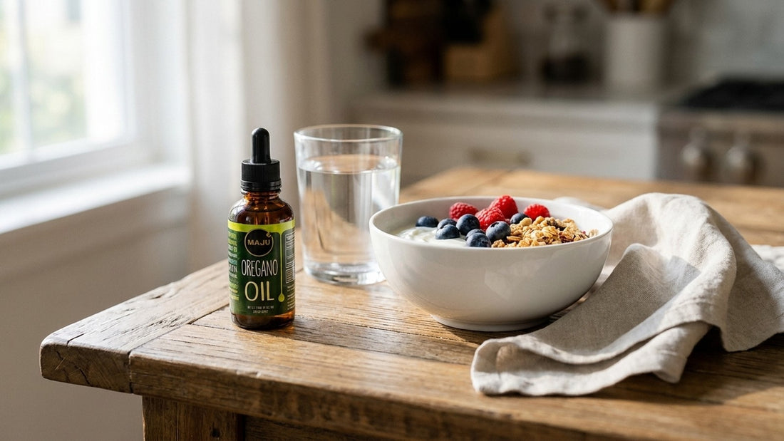 MAJU oregano oil bottle on a calm breakfast table with yogurt bowl