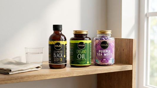 MAJU black seed oil, oregano capsules and sea moss on a morning shelf